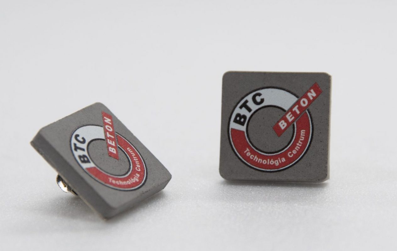 Colored printed concrete pin for cement techology company's employees