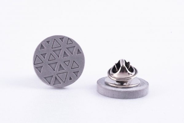 Concrete pin with triangle pattern made for architects