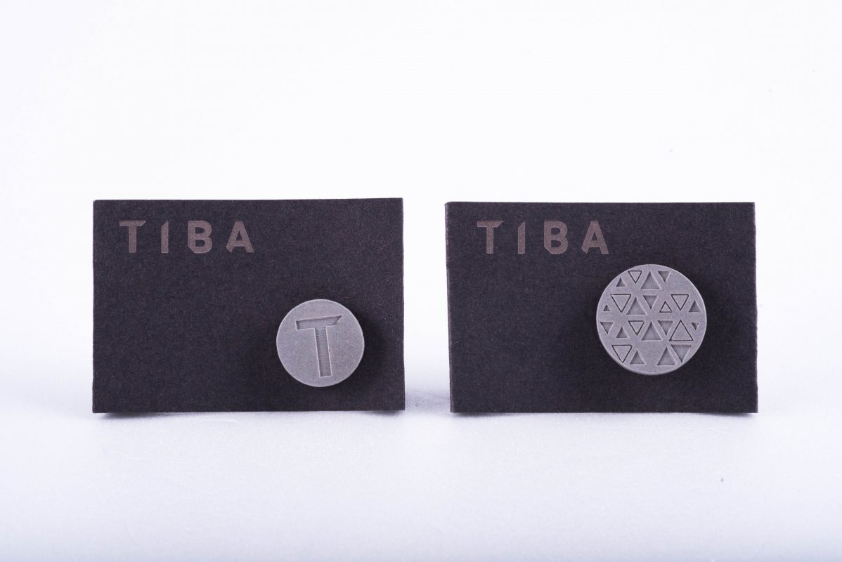 Custom made branded designer corporate gifts. Concrete pin for architecture studio employees