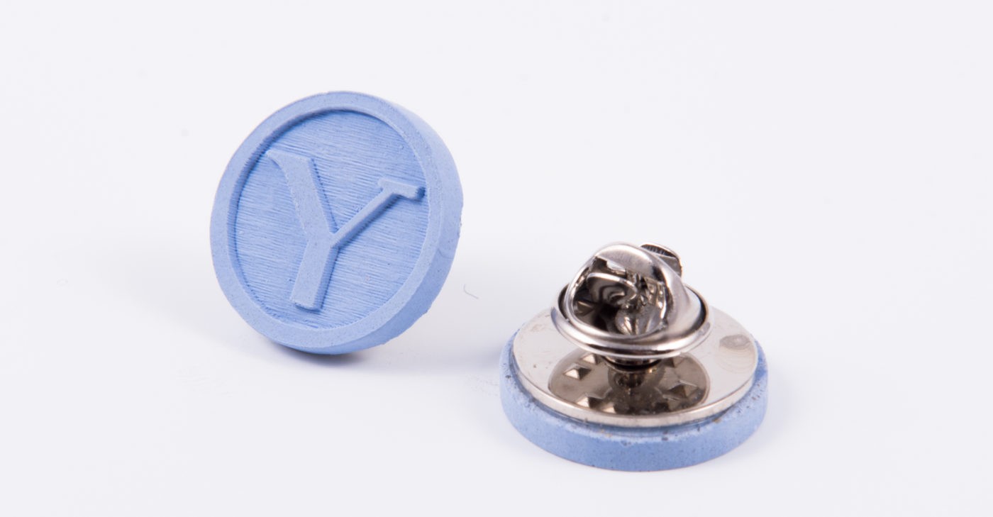 Blue concrete pins with university logo for architecture students