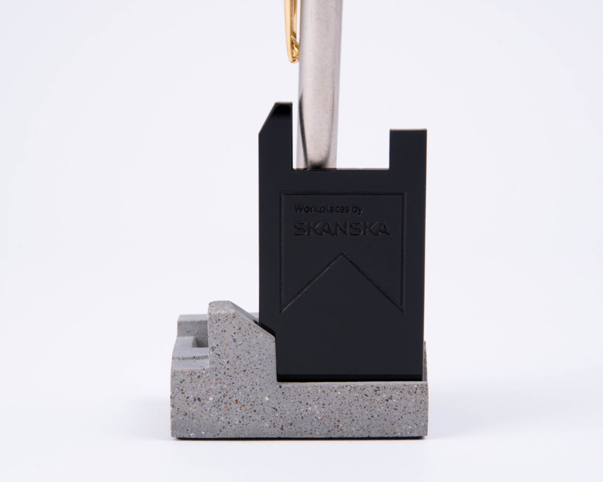 Branded concrete and acrylic pen holder for Skanska